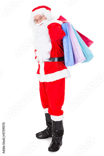 Photo: Portrait of santa holding shopping bag Portrait of santa holding shopping bag