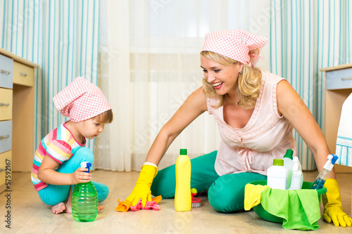 Photo: mother and kid cleaning room mother and kid cleaning room