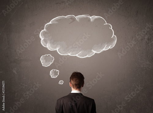 Photo: Businessman with cloud thought above his head Businessman with cloud thought above his head