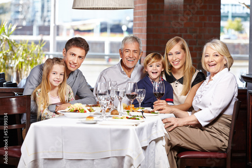 Photo: Family with children and seniors in restaurant Family with children and seniors in restaurant