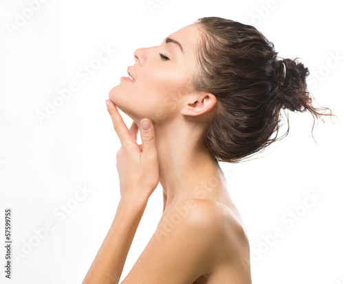 Photo: Beauty Portrait. Beautiful Spa Girl Touching her Face Beauty Portrait. Beautiful Spa Girl Touching her Face