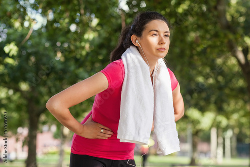 Photo: Pretty sporty woman having a break from running Pretty sporty woman having a break from running