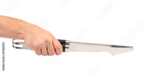 Photo: Hand holds kitchen knife. Hand holds kitchen knife.