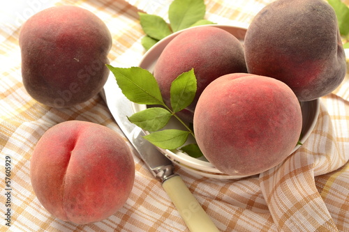 Photo: Fresh peaches in a bowl on the table Fresh peaches in a bowl on the table