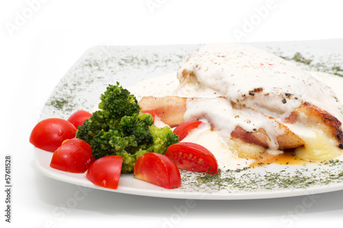 Photo: Chicken with gorgonzola, vegetables and bread on the plate Chicken with gorgonzola, vegetables and bread on the plate