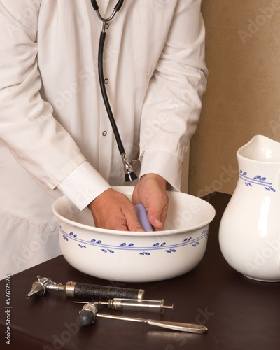 Photo: Vintage doctor washing hands Vintage doctor washing hands