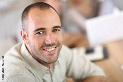 Photo: Young man attending business school project Young man attending business school project