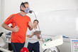 Photo: Sports scientist with digital tablet monitoring runner with mask on treadmill in laboratory Sports scientist with digital tablet monitoring runner with mask on treadmill in laboratory