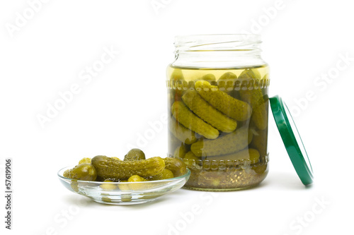 Photo: pickled cucumbers close-up on a white background. horizontal pho pickled cucumbers close-up on a white background. horizontal pho
