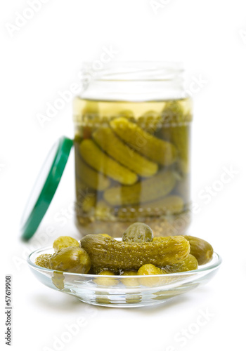Photo: pickled cucumbers isolated on white background pickled cucumbers isolated on white background