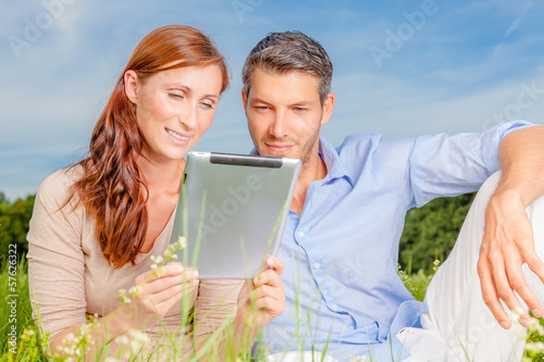 Photo: green couple with tablet green couple with tablet
