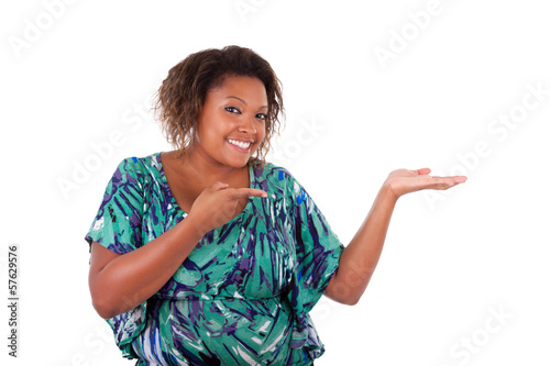 Photo: African American woman smiling holding something in her hand pal African American woman smiling holding something in her hand pal