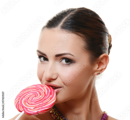 Photo: The girl with sugar candy isolated The girl with sugar candy isolated