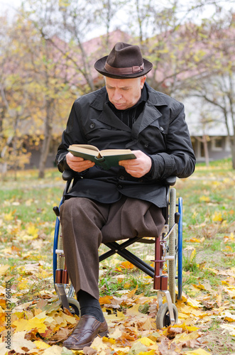 Photo: Handicapped elderly man in a wheelchair Handicapped elderly man in a wheelchair