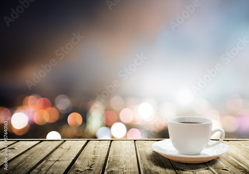 Photo: coffee on table in the night city coffee on table in the night city