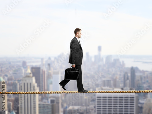 Photo: businessman walking on a rope businessman walking on a rope