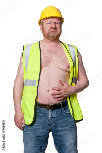 Photo: Builder with stomache ache, in hard hat - isolated on white Builder with stomache ache, in hard hat - isolated on white