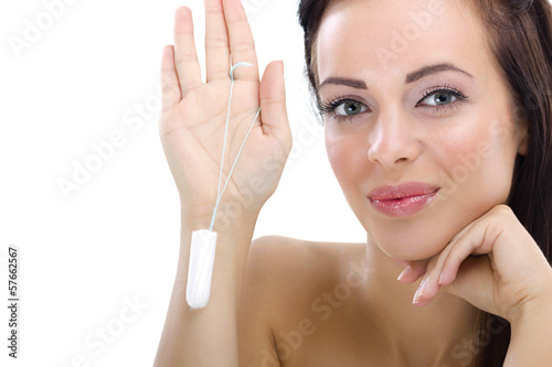 Photo: woman holding cotton hygienic tampon woman holding cotton hygienic tampon