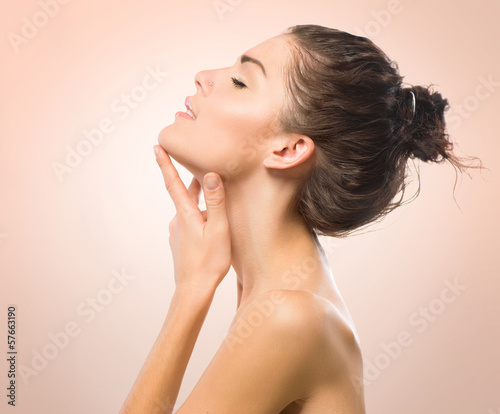 Photo: Beauty Portrait. Beautiful Spa Girl Touching her Face Beauty Portrait. Beautiful Spa Girl Touching her Face