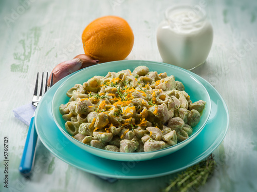 Photo: pasta with artichoke cream and orange peel, selective focus pasta with artichoke cream and orange peel, selective focus