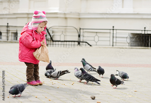 Photo: toddler feeding doves toddler feeding doves