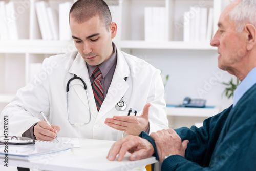 Photo: Doctor talking to senior patient Doctor talking to senior patient