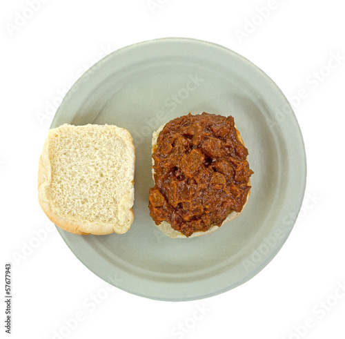Photo: Chipped pork in barbecue sauce sandwich on a paper plate Chipped pork in barbecue sauce sandwich on a paper plate