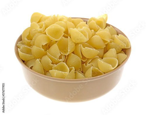 Photo: Small pasta shells in a tan bowl Small pasta shells in a tan bowl