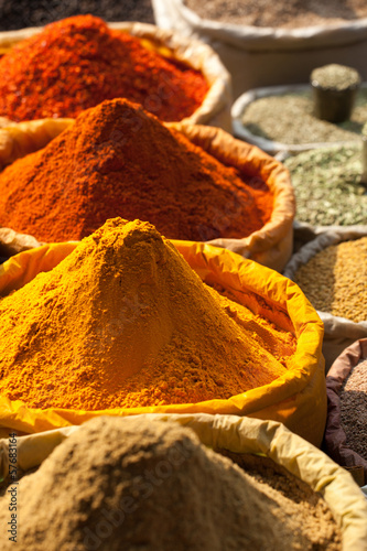 Fototapeta Traditional spices and dry fruits in local bazaar in India.