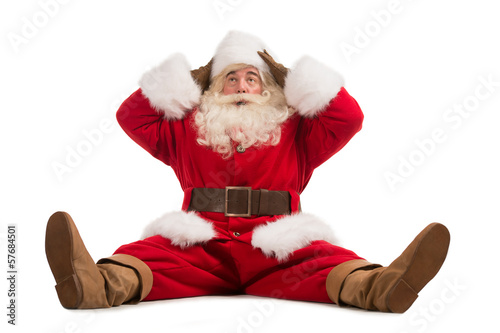 Photo: Hilarious and funny Santa Claus confused while sitting Hilarious and funny Santa Claus confused while sitting