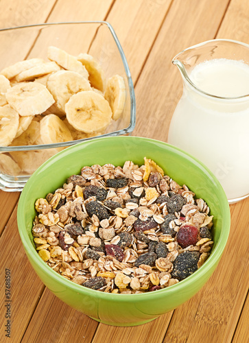 Photo: Delicious and healthy cereal in bowl with milk Delicious and healthy cereal in bowl with milk