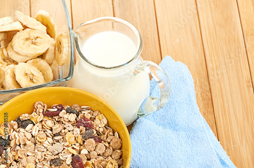 Photo: Delicious and healthy cereal in bowl with milk Delicious and healthy cereal in bowl with milk
