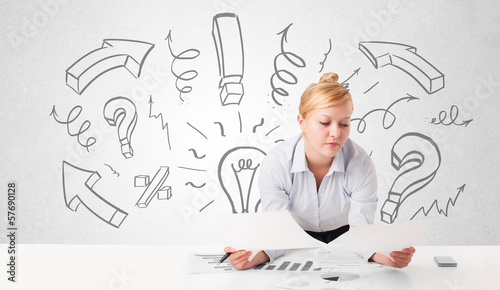 Photo: Attractive businesswoman brainstorming with drawn arrows and sym Attractive businesswoman brainstorming with drawn arrows and sym