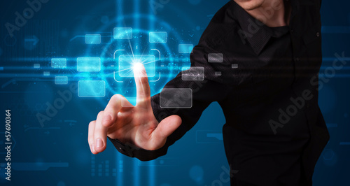 Photo: Businessman pressing high tech type of modern buttons Businessman pressing high tech type of modern buttons
