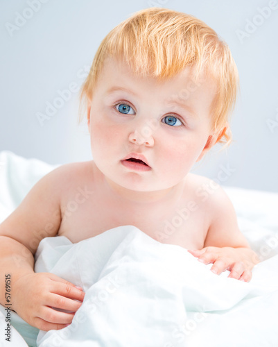 Photo: baby sitting in bed baby sitting in bed