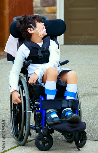 Photo: Seven year old biracial disabled boy in wheelchair Seven year old biracial disabled boy in wheelchair