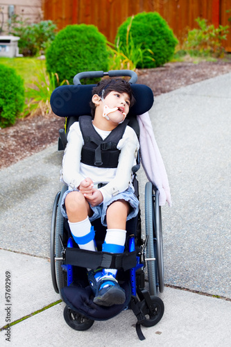 Photo: Seven year old biracial disabled boy in wheelchair Seven year old biracial disabled boy in wheelchair