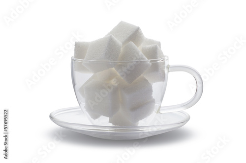 Photo: cubes sugar in glass cup isolated on white background cubes sugar in glass cup isolated on white background