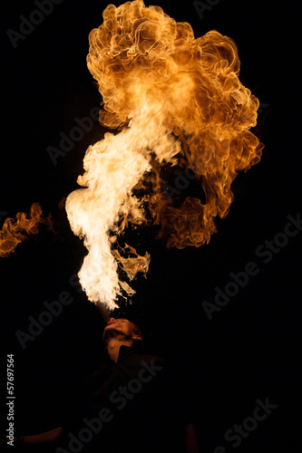 Photo: Fakir breathes spurts of flame in the dark Fakir breathes spurts of flame in the dark