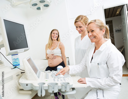 Photo: Gynecologists Using Ultrasound Machine At Clinic Gynecologists Using Ultrasound Machine At Clinic