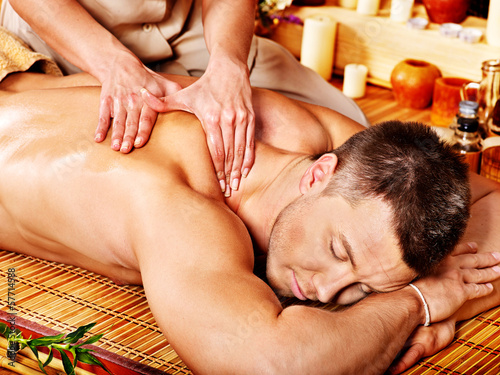 Photo: Woman getting bamboo massage. Woman getting bamboo massage.