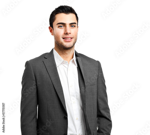 Photo: Smiling businessman isolated on white Smiling businessman isolated on white
