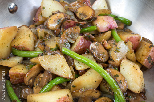 Photo: A very close view of vegetables cooking in a skillet A very close view of vegetables cooking in a skillet