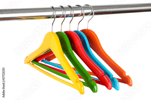 Photo: Colorful clothes hangers isolated on white Colorful clothes hangers isolated on white
