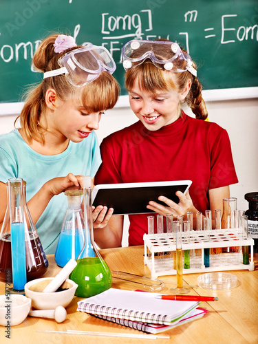 Photo: Child in chemistry class. Child in chemistry class.