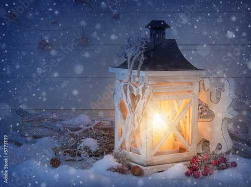 Photo: Burning lantern and christmas decoration Burning lantern and christmas decoration