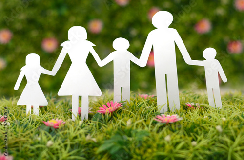 Photo: Family from paper on grass Family from paper on grass