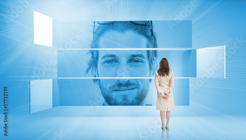 Photo: Rear view of businesswoman looking at smiling man Rear view of businesswoman looking at smiling man