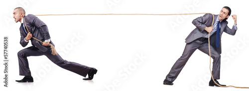 Photo: Man in tug of war concept on white Man in tug of war concept on white
