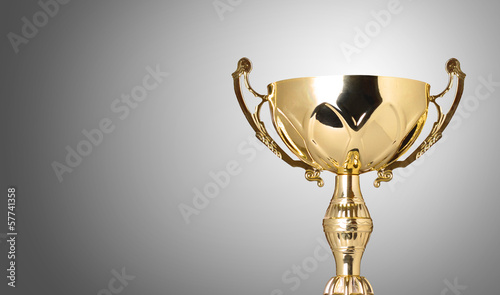 Illustration: close up champion golden trophy on grey background close up champion golden trophy on grey background